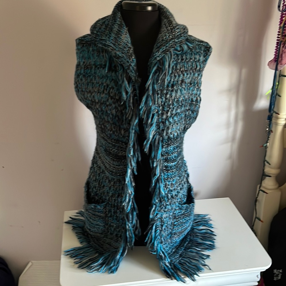 Long sweater vest with hood.  Never worn